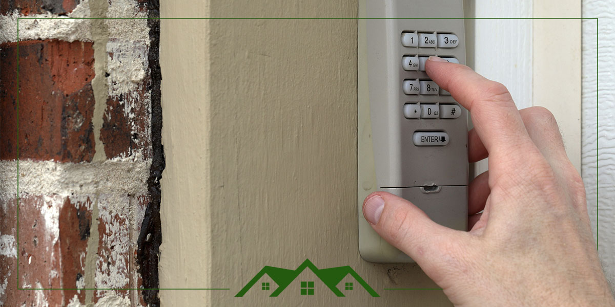Hand entering a garage door PIN into keypad